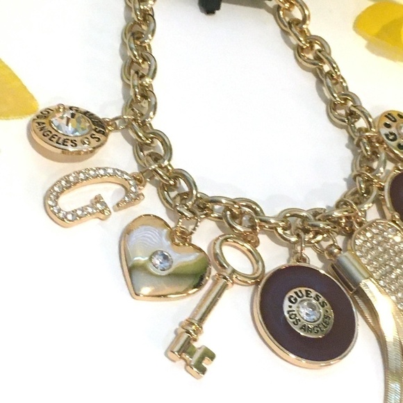 𝅺3/$29! GUESS Charm Bracelet Heart, Key, Tassel - Picture 3 of 9